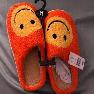 Orange Smiley Face Slippers size 7/8
